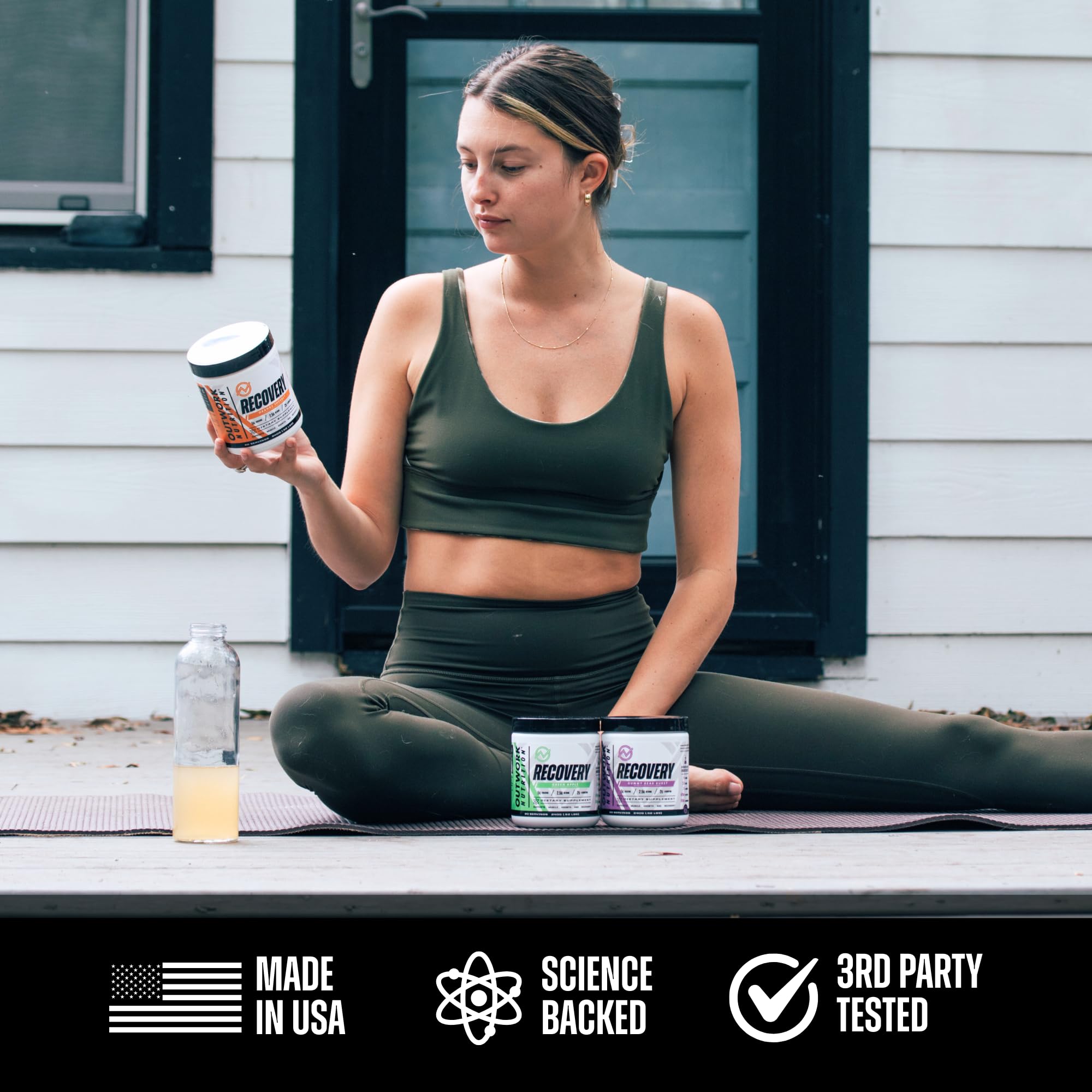 Outwork Nutrition shaker beside the recovery powder for on-the-go use.