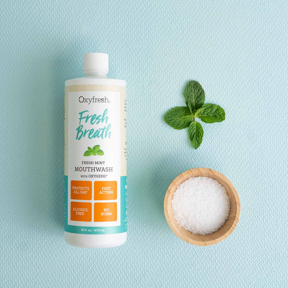 Oxyfresh fresh mint mouthwash cap close-up—seal preserves the formula's freshness.