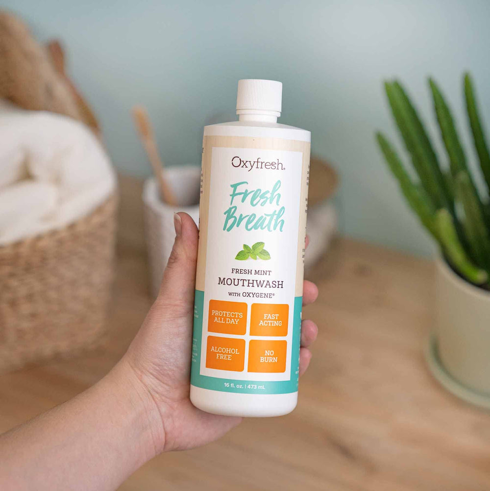 Oxyfresh mouthwash label close-up—peppermint oil and xylitol highlight gentle care.