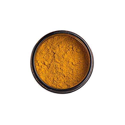PAAVANI Golden Milk tub close-up highlights vibrant turmeric color.