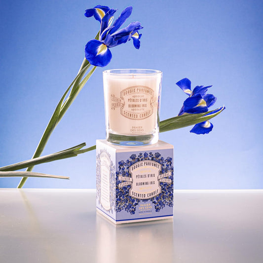 Panier des Sens Iris Candle wick glowing for a calm, cozy ambiance.