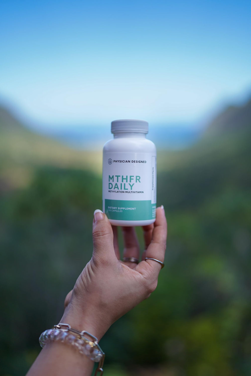 PD VARS MTHFR Daily Multivitamin lifestyle-shot featuring bottle on desk for daily wellness.