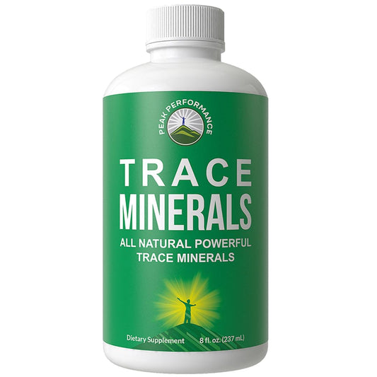 Peak Performance trace minerals liquid drops bottle being poured into a glass of water.