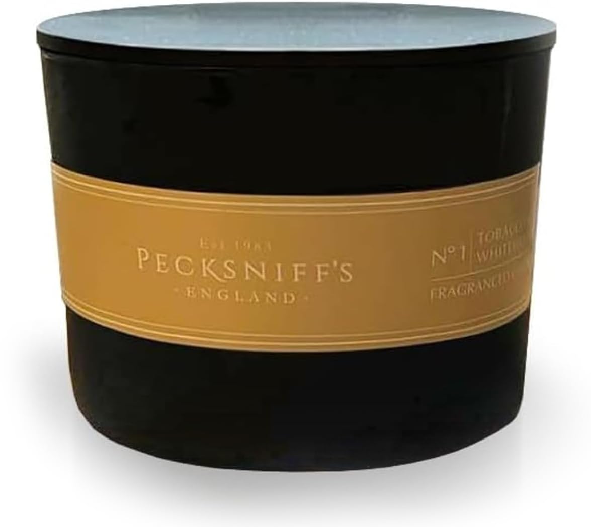 Pecksniff's Black Tobacco & White Wood candle with three wicks for an even, radiant burn.