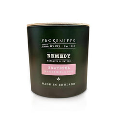 Pecksniff's Grateful Candle three-wick jar for balanced, even burn.