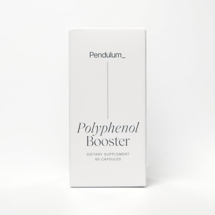 Pendulum Polyphenol Booster scoop next to bottle for easy measuring.