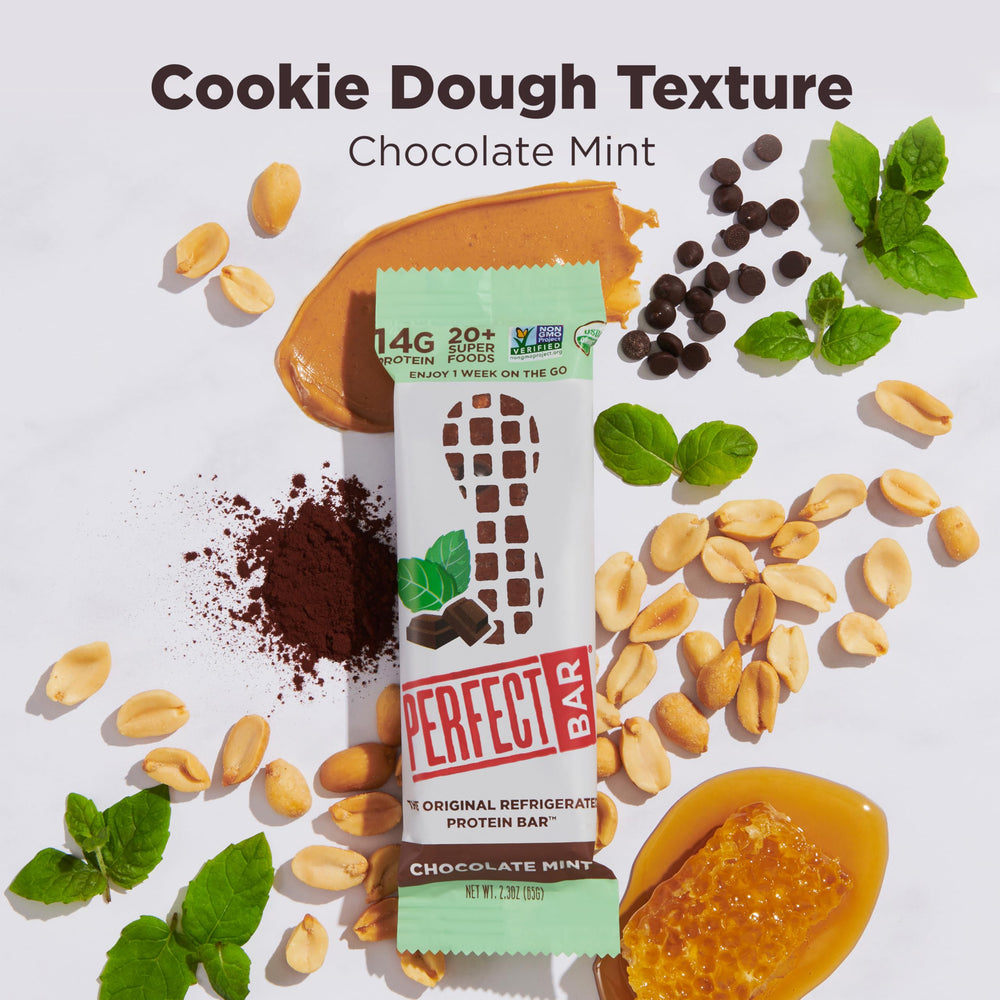 Ingredient shot of Perfect Bar Chocolate Mint Peanut Butter Bar with peanuts and honey for natural energy.