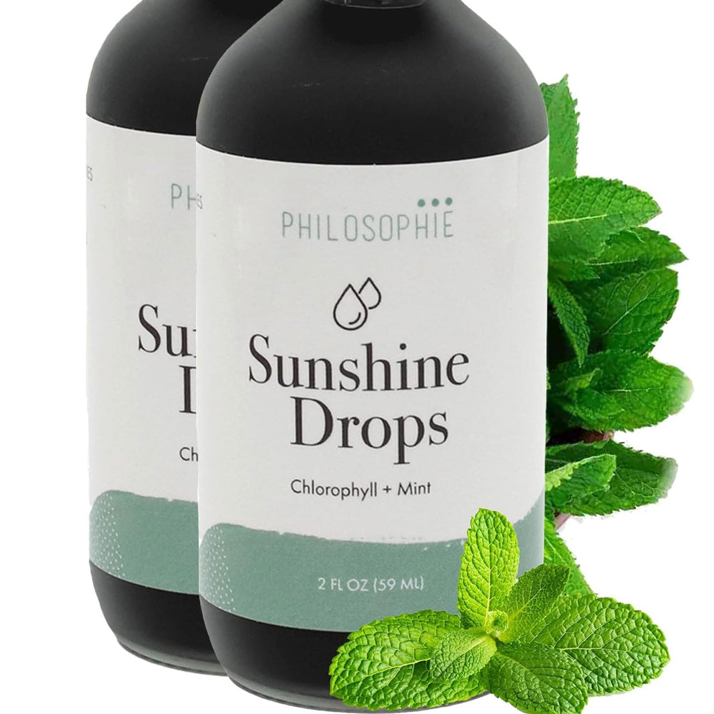 Philosophie Liquid Chlorophyll Sunshine Drops bottle on a kitchen counter, promoting hydration and wellness.