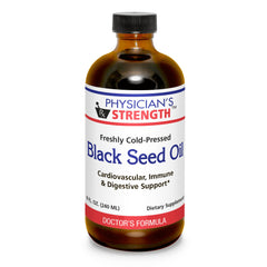 Physician's Strength black seed oil bottle on kitchen counter ready for daily use in salads.
