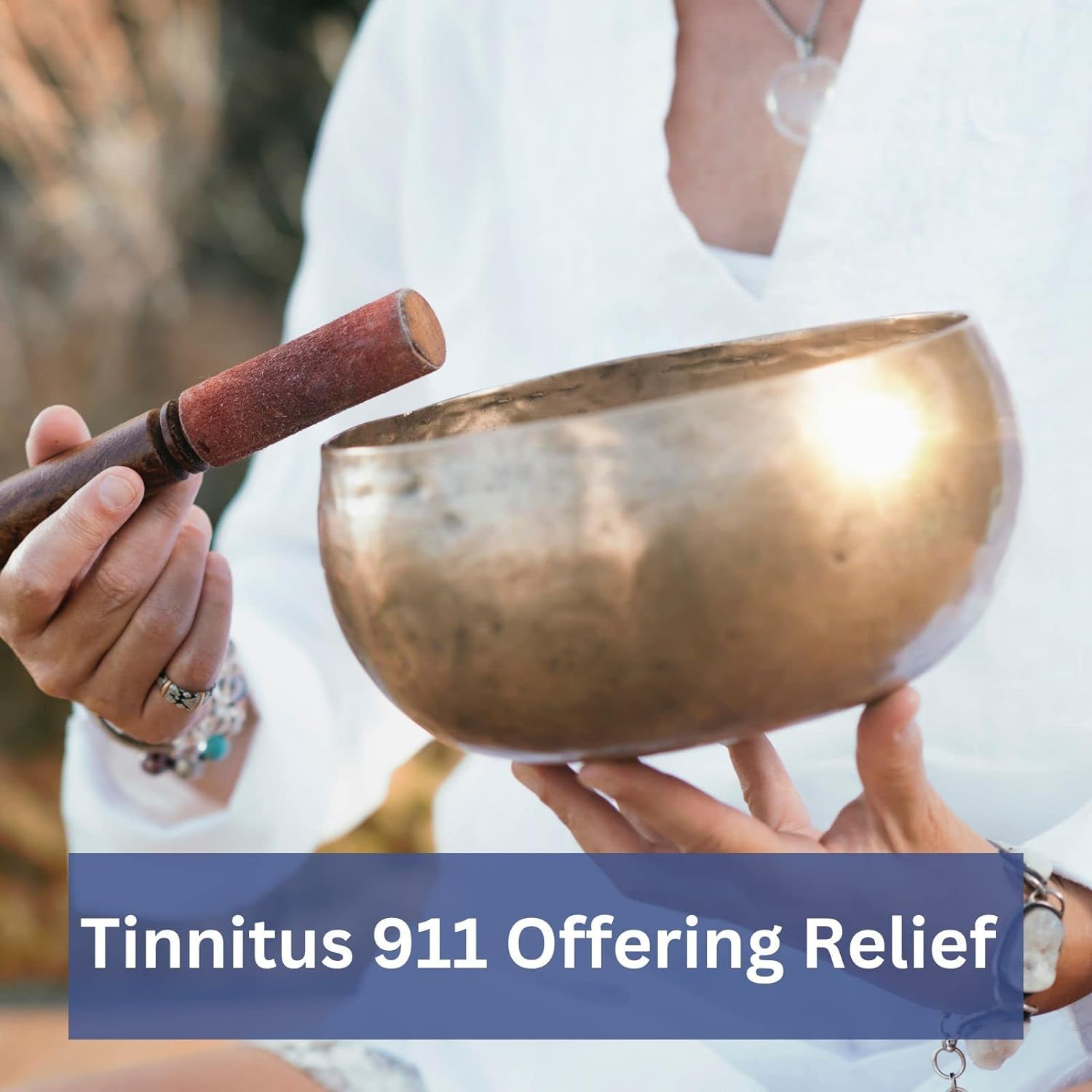 Phytage Labs Tinnitus 911 hand holding a capsule for routine use