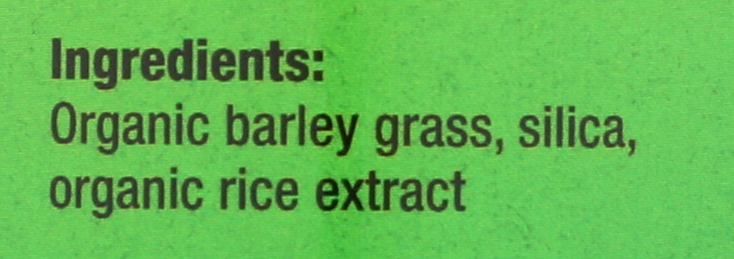 Pines Barley Grass tablets in hand for easy on-the-go greens.
