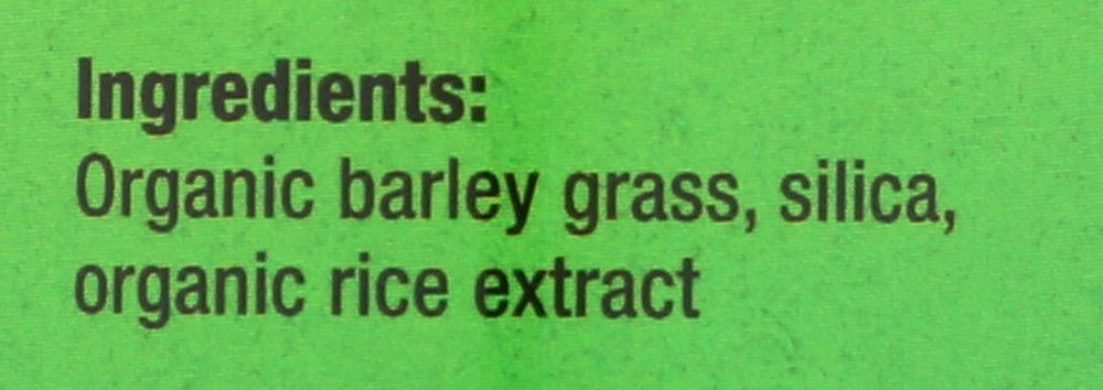 Pines Barley Grass tablets in hand for easy on-the-go greens.