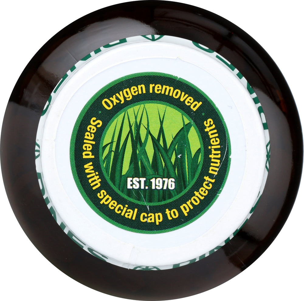 Pines barley grass tablets with juice to show simple daily integration.