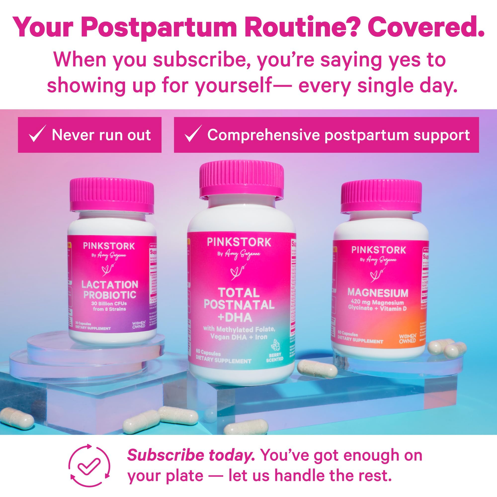 Closeup of two small Pink Stork Total Postnatal capsules for daily use