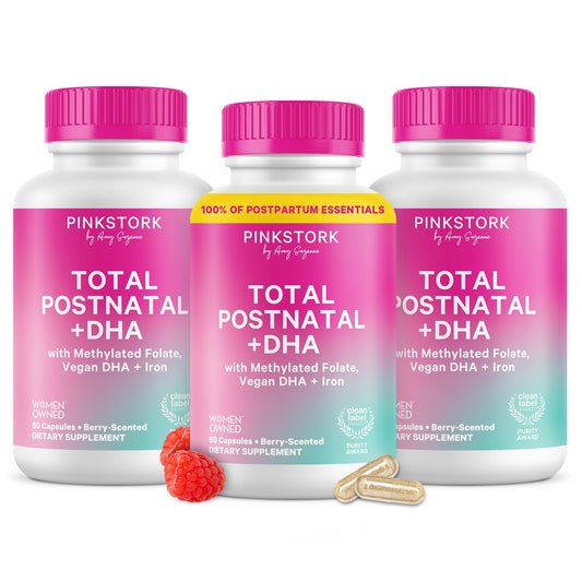 Pink Stork Total Postnatal Vitamins bottle on counter for daily postpartum support.