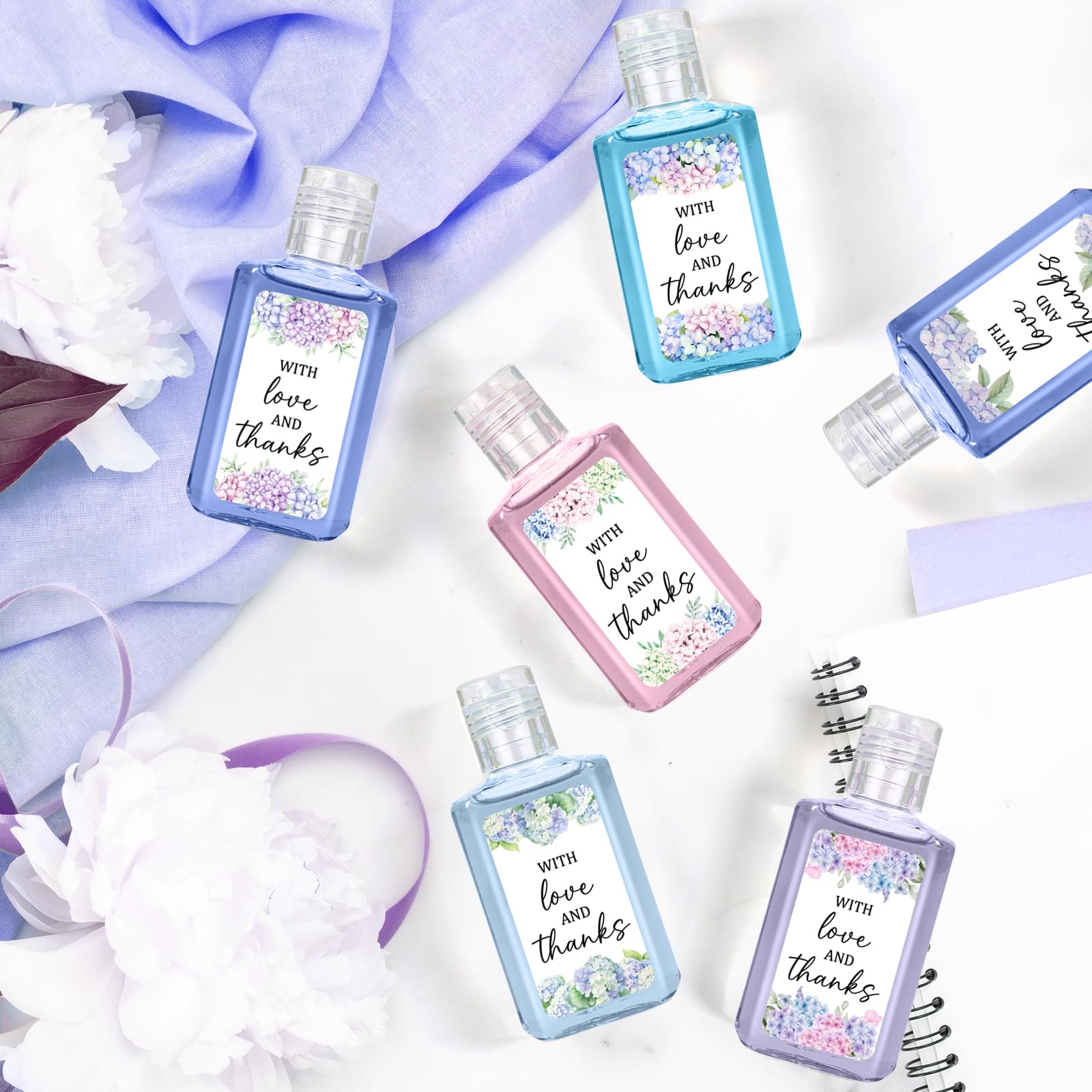 Piuaeue wedding sanitizer gifts arranged on reception tables as stylish favors.