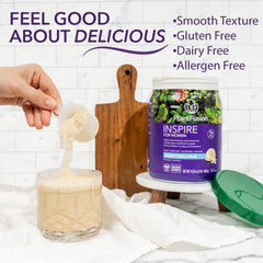 PlantFusion Inspire Women shake in glass, creamy vanilla texture.