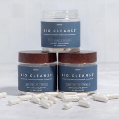 Plexus Bio Cleanse packaging next to fresh fruit to imply digestive wellness.