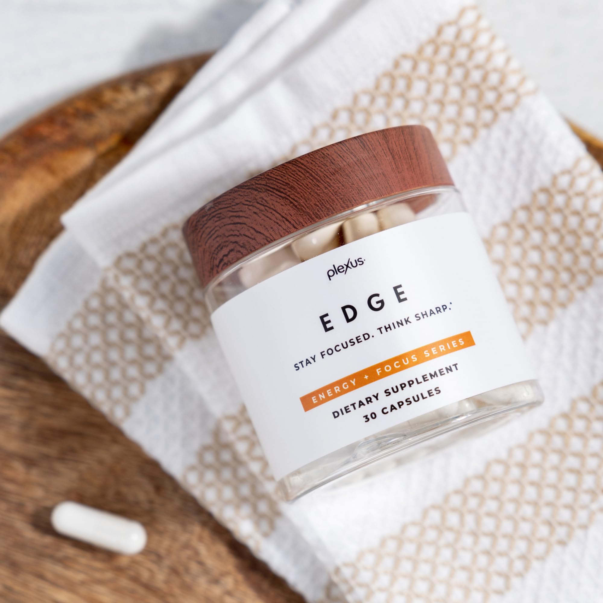 Plexus Edge capsules arranged on desk for convenient daytime use.