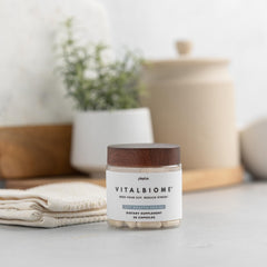 Plexus VitalBiome capsule beside a calm mood setting implying stress support
