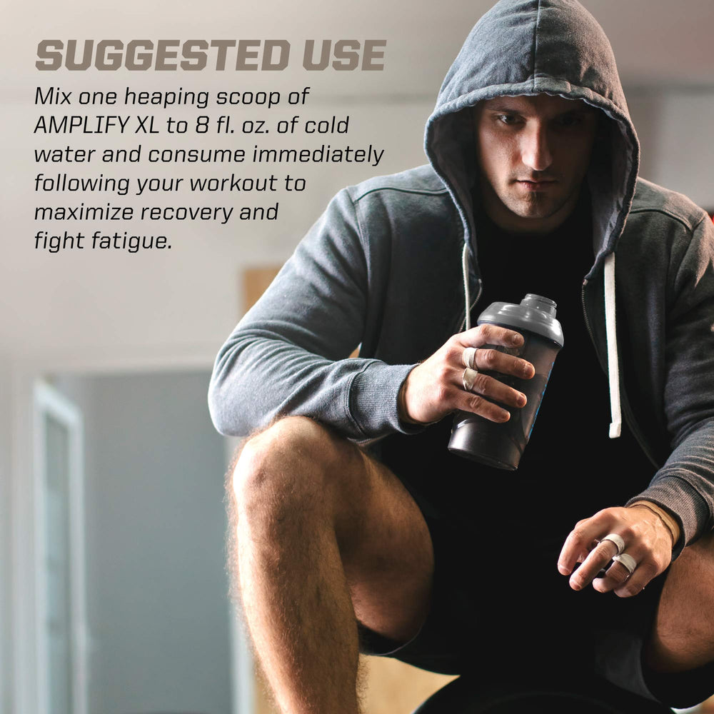 PMD Amplify XL greens blend superfood mix beside supplements for daily routine.