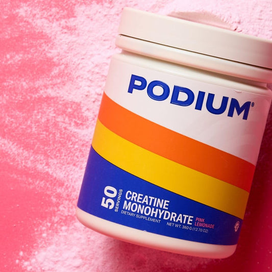 Podium Nutrition Solos creatine powder dissolving in water for smooth mixing.