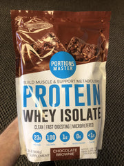 Portions Master CFM Whey Isolate chocolate brownie flavor tub on a clean counter