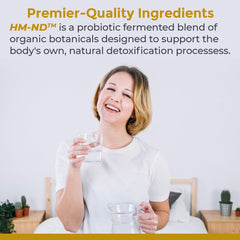 Fermented HM-ND drops in a glass illustrate convenient detox ritual.