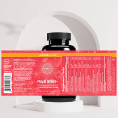 Primal Harvest Women+ energy-boost capsules held in hand.