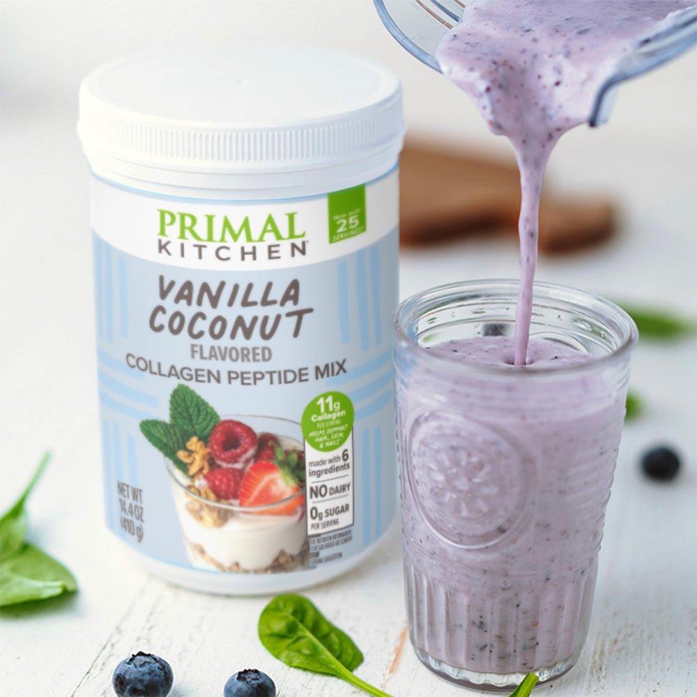 Primal Kitchen Collagen Fuel Vanilla Coconut on kitchen counter with ingredients