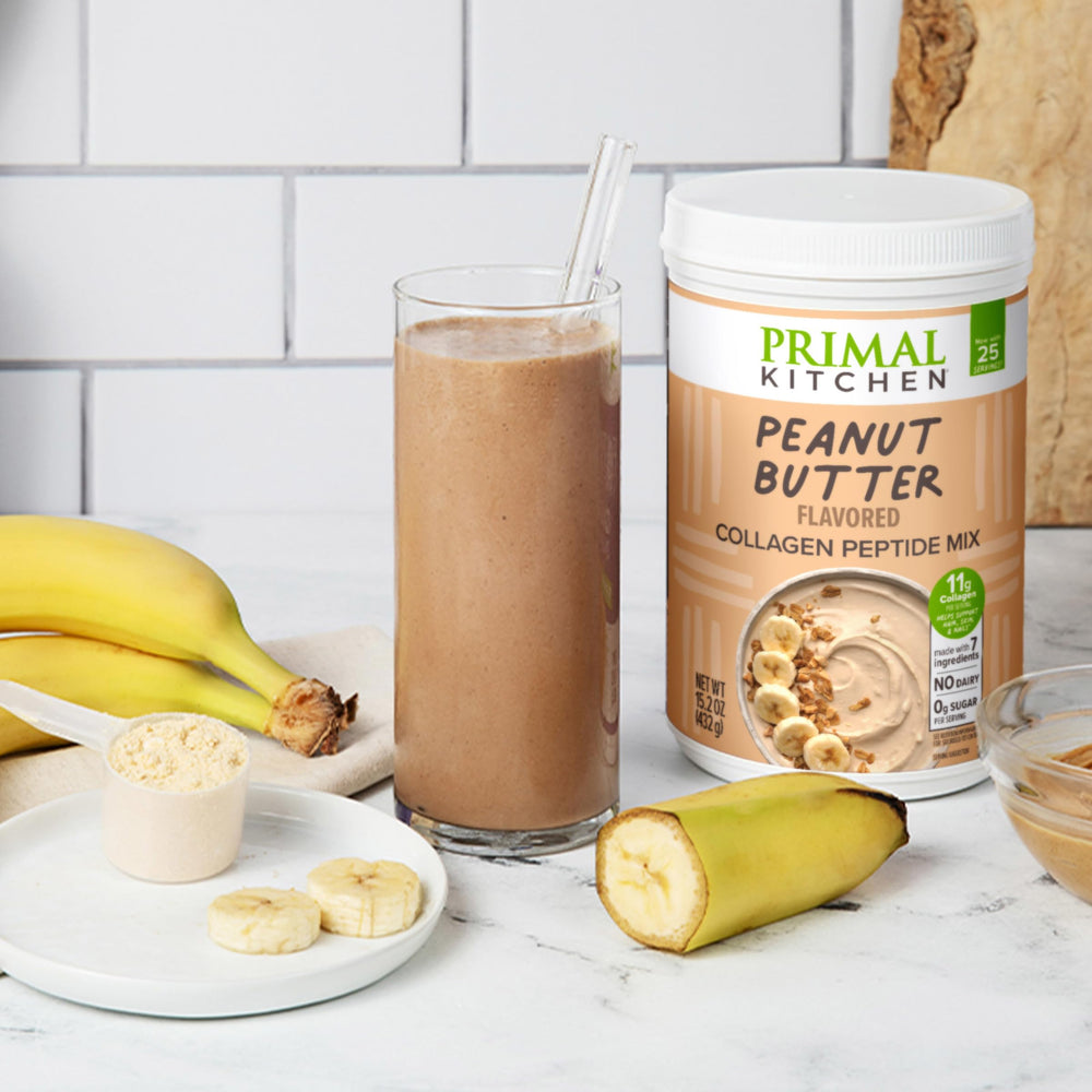Primal Kitchen Peanut Butter Collagen Fuel Drink canister on shelf for easy scoops.