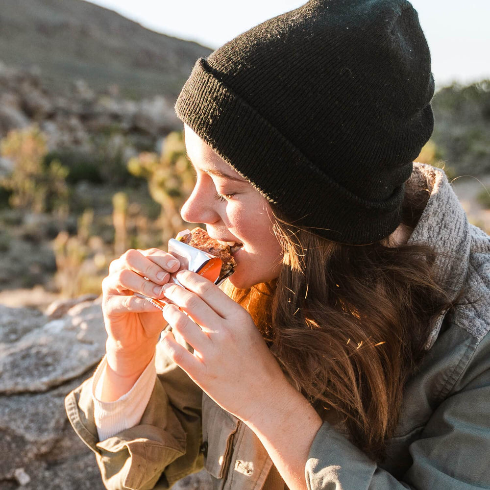 PROBAR Blueberry Muffin Meal Bar on-the-go scene shows quick breakfast fuel.