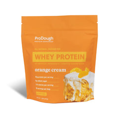 ProDough Orange Cream protein powder in a jar for smooth shakes.