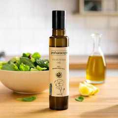 Hands applying Prof Saracoglu flaxseed oil for hair care.