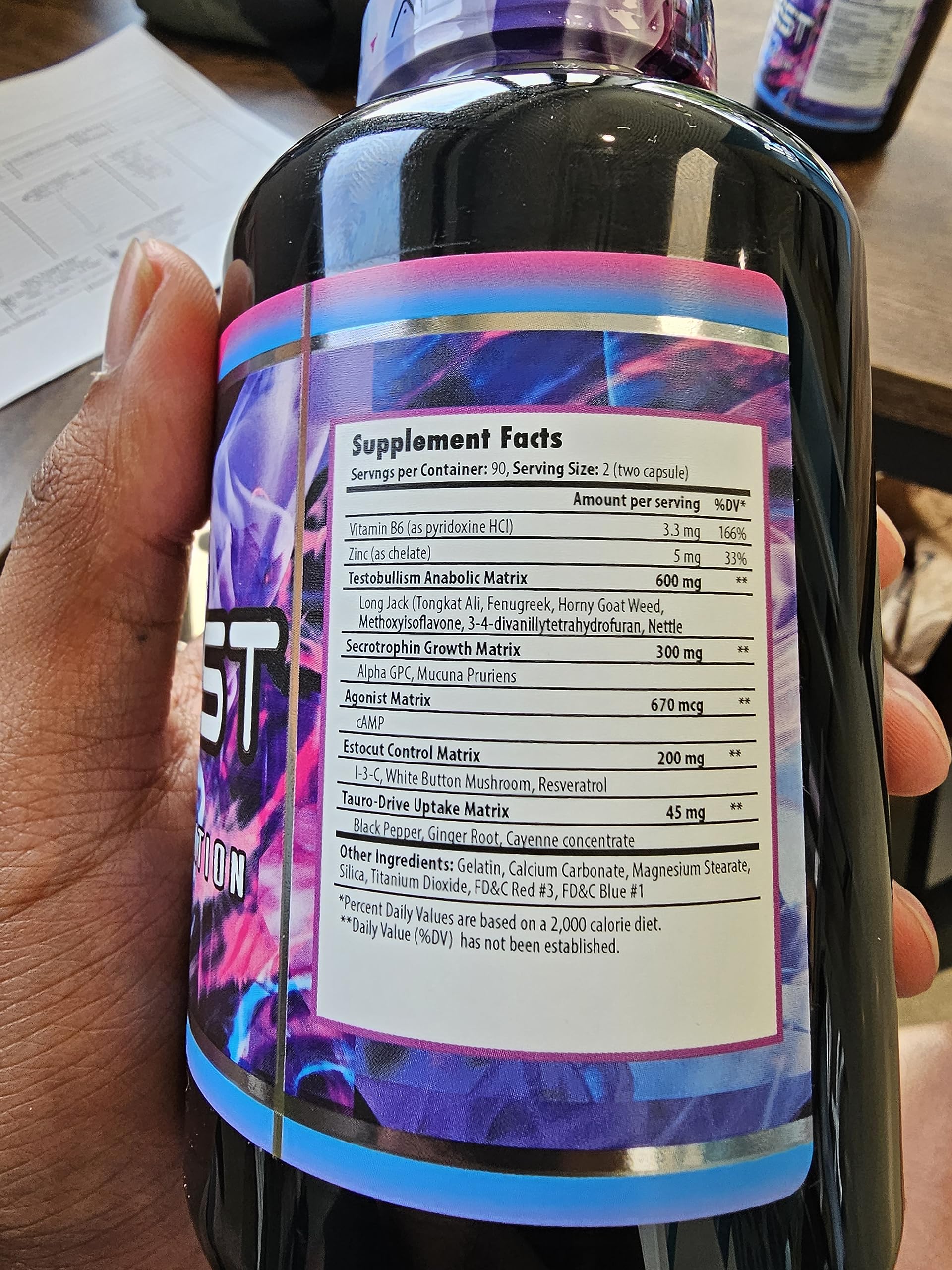 TauroTest bottle label close-up showing supplement details.