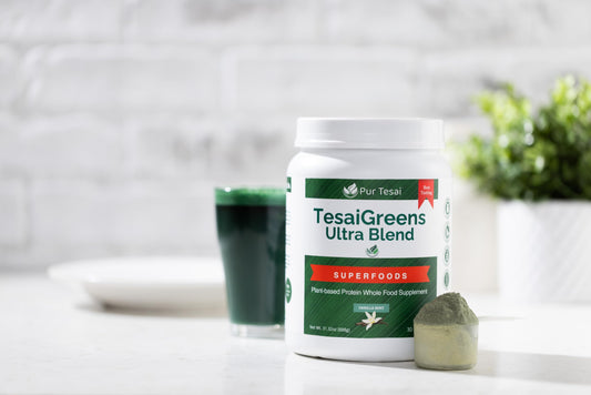 Pur Tesai Greens Ultra Blend scoop beside powder for a quick smoothie boost