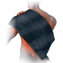 Pure Enrichment PureRelief Pro 12x24 pad on bed offering broad back coverage for comfort.