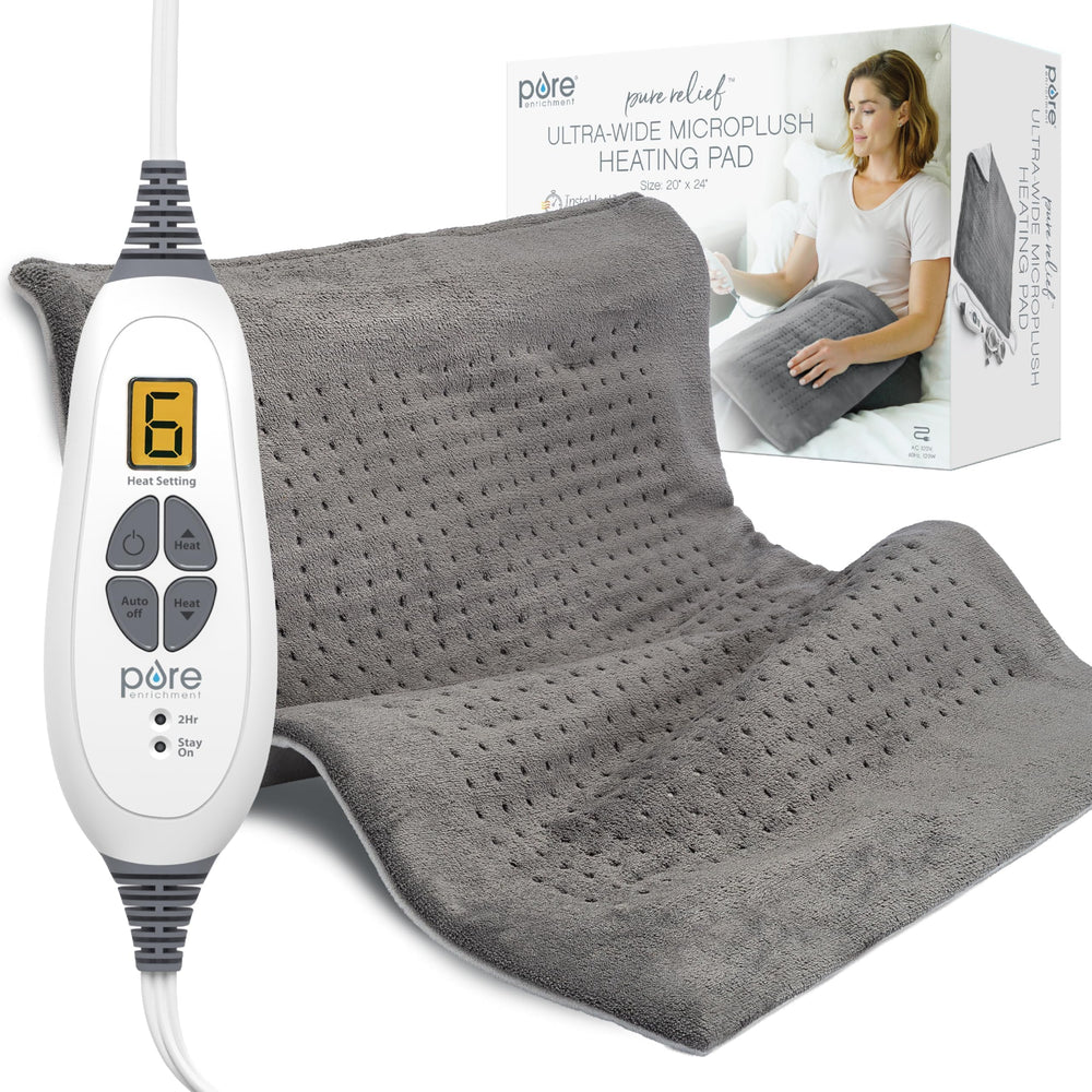 Pure Enrichment PureRelief Ultra-Wide heating pad on bed delivers full back and shoulder coverage for comfort.