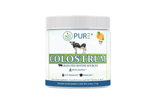PURE Grass-Fed Colostrum Powder bottle on a counter, signaling daily vitality and clean nutrition.