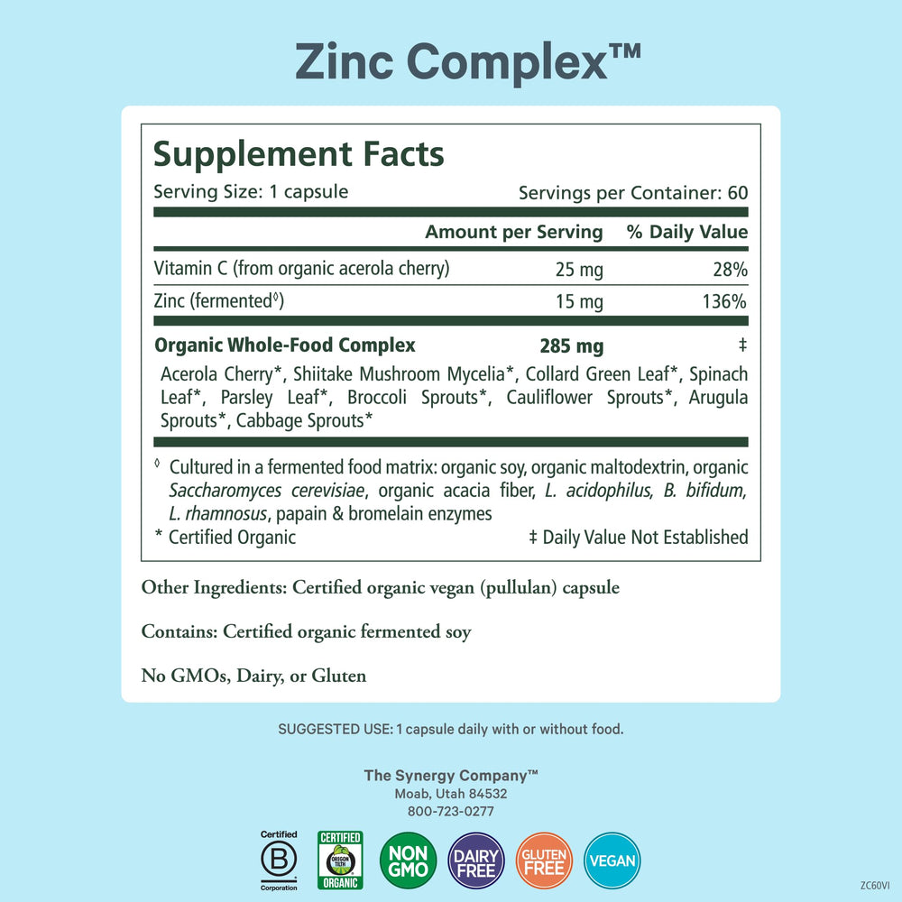 Closeup of PURE SYNERGY Zinc Complex capsules illustrating gentle digestion and plant cofactors.