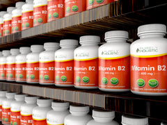 Purely Holistic Vitamin B2 bottle with glass emphasising everyday wellness routine