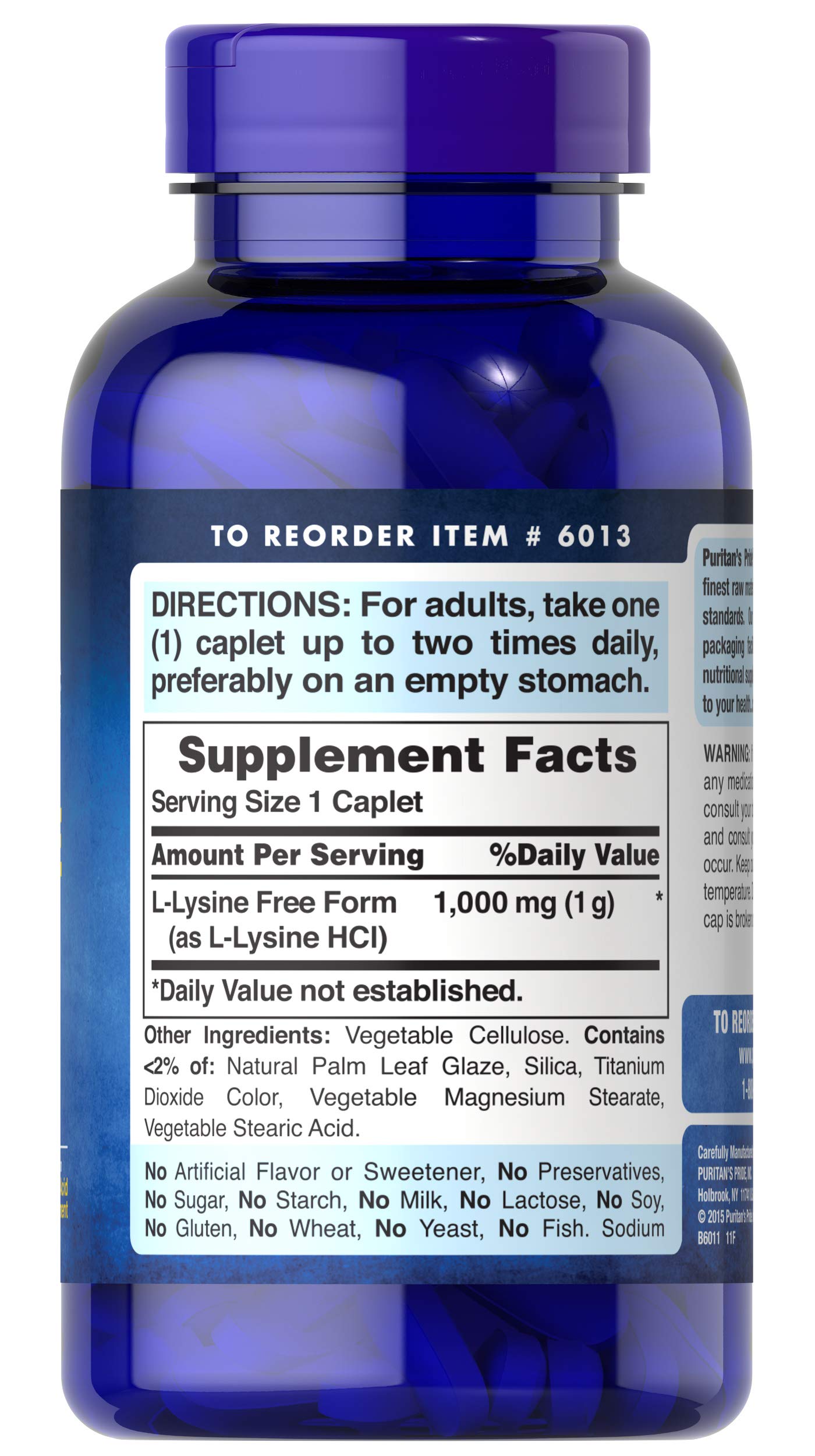 Puritan's Pride L-Lysine caplets close-up, gluten- and soy-free vegetarian formula.