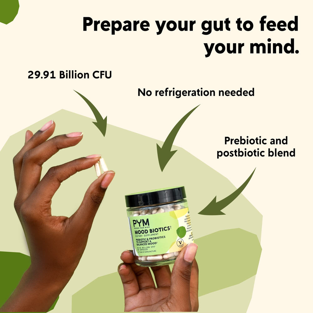 Glass of water with Mood Biotics capsules for easy daily intake