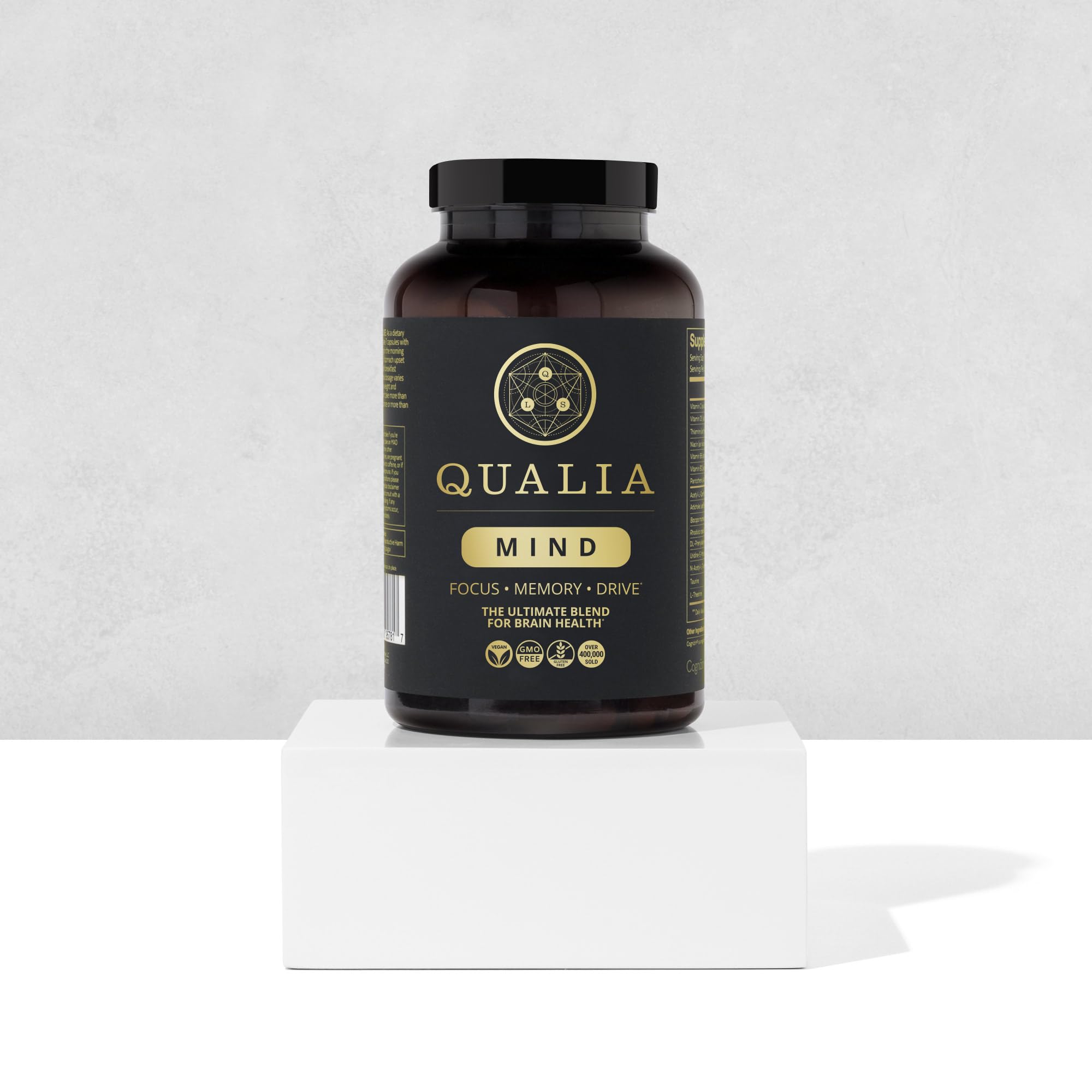 Qualia Mind packaging highlighting vegan, non-GMO, gluten-free standards