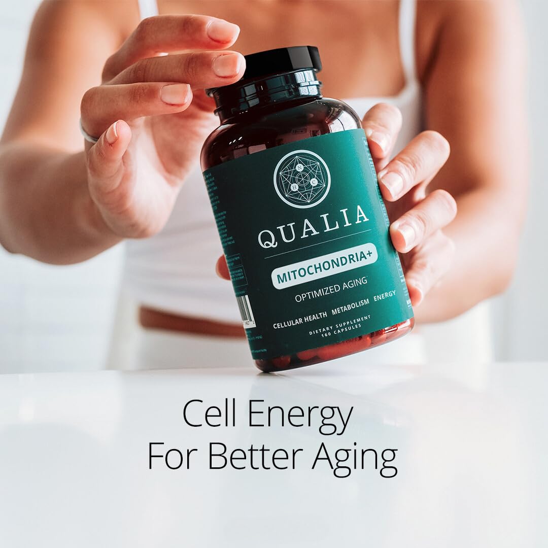 Qualia Mitochondria+ glass jar with gold cap seen as premium supplement for aging support.