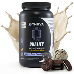Qualify Cookies & Cream Protein Powder tub on the counter, 25g protein per serving.