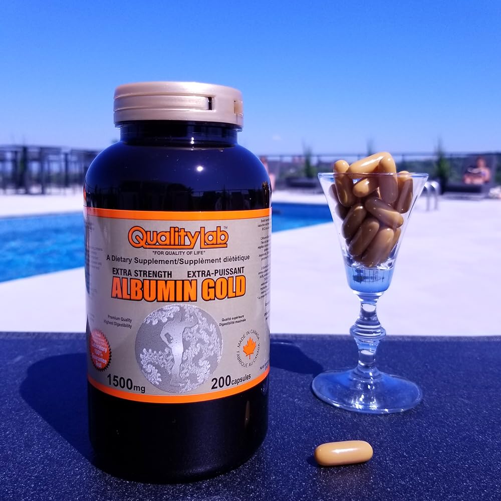 QualityLab Albumin Gold bottle in hand conveys portability for routines.