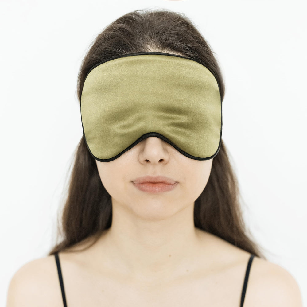 Quietstore silk sleep mask green packaging, travel-ready design.