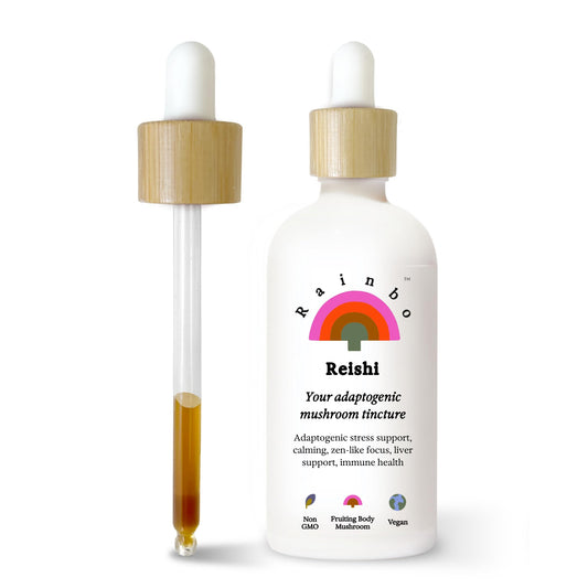 Rainbo Reishi tincture bottle on a counter, highlighting alcohol-free extraction for daily use.