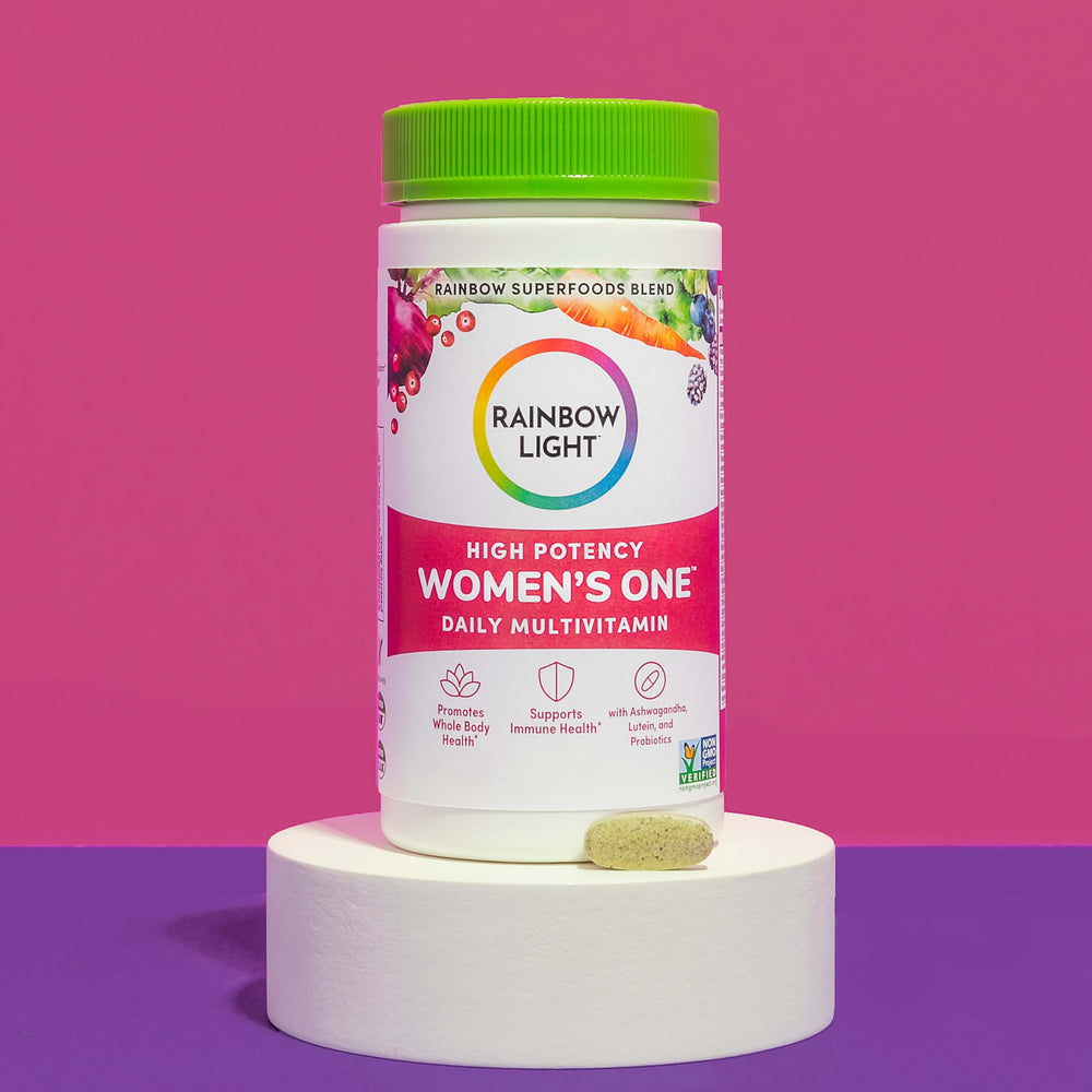 Rainbow Light Women's One powder on the kitchen counter ready to scoop.